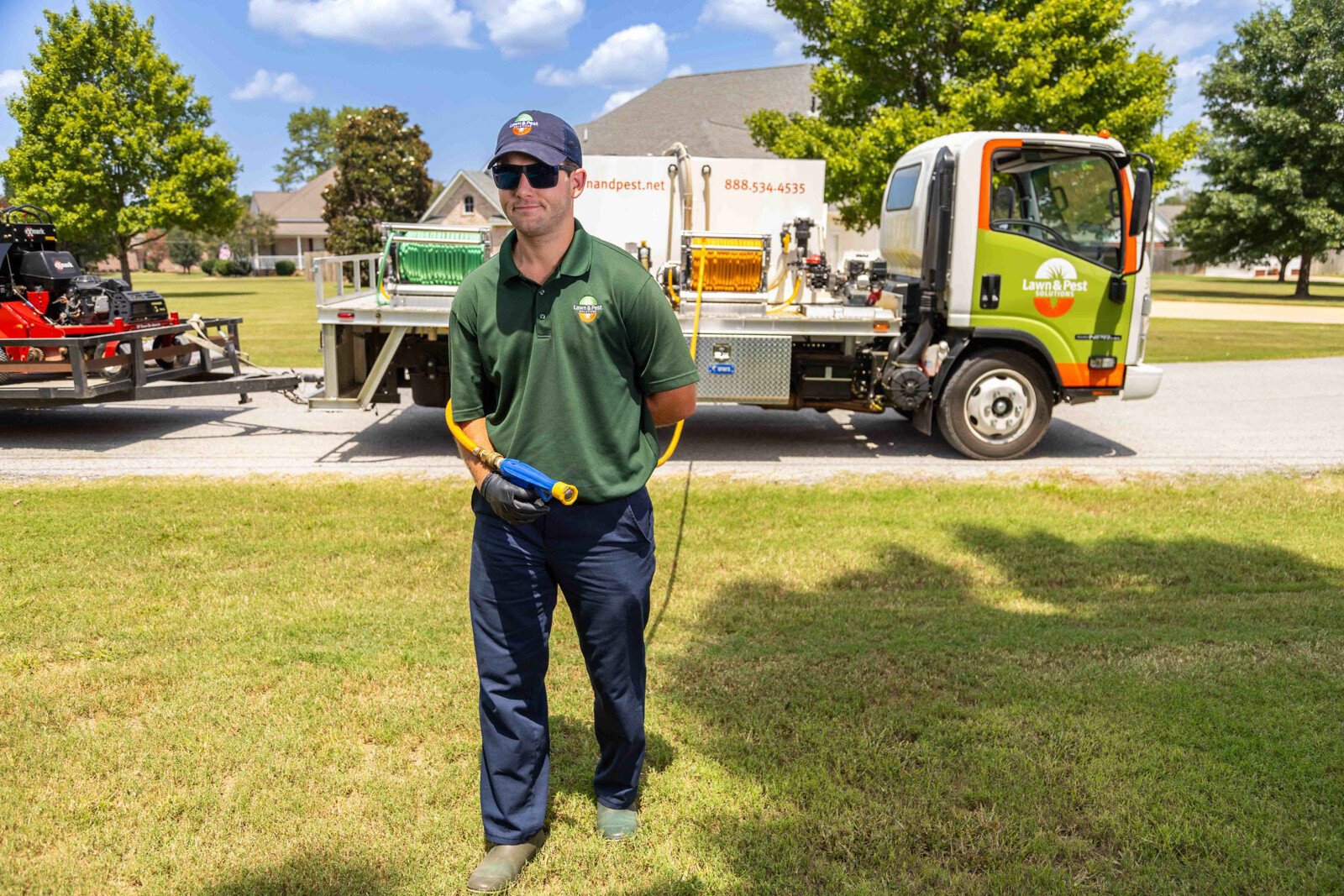 lawn care truck technician crew spray hose treatment yard 5-1