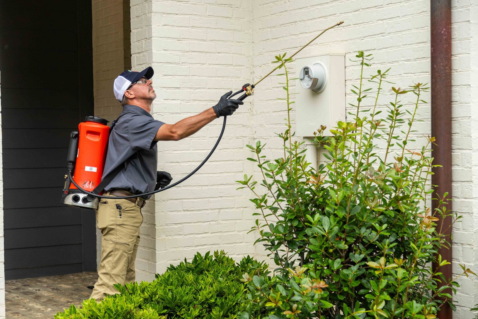 pest control tech crew spray tank treatment home front entry perimeter 8