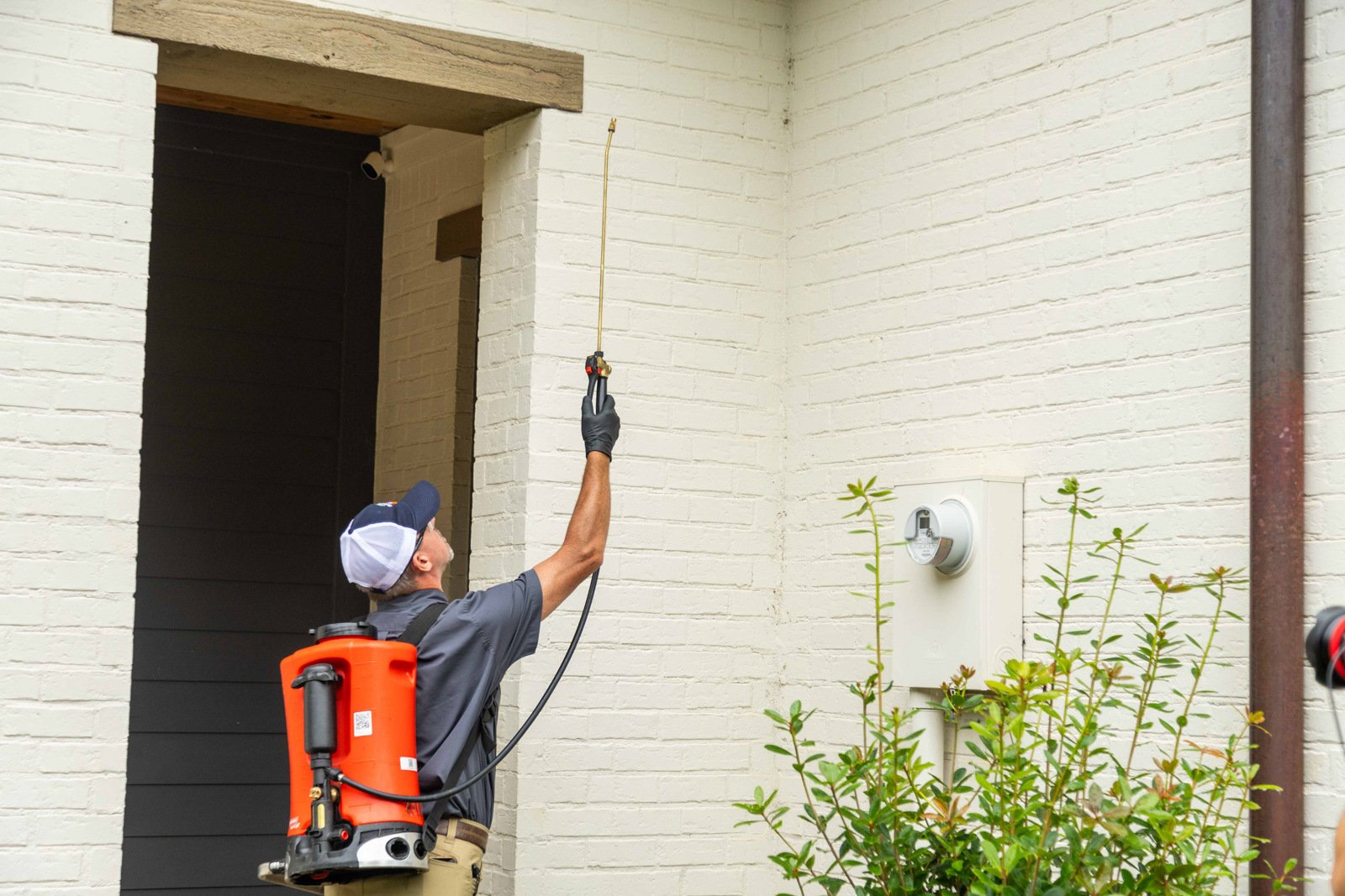 pest control tech crew spray tank treatment home front entry perimeter 9