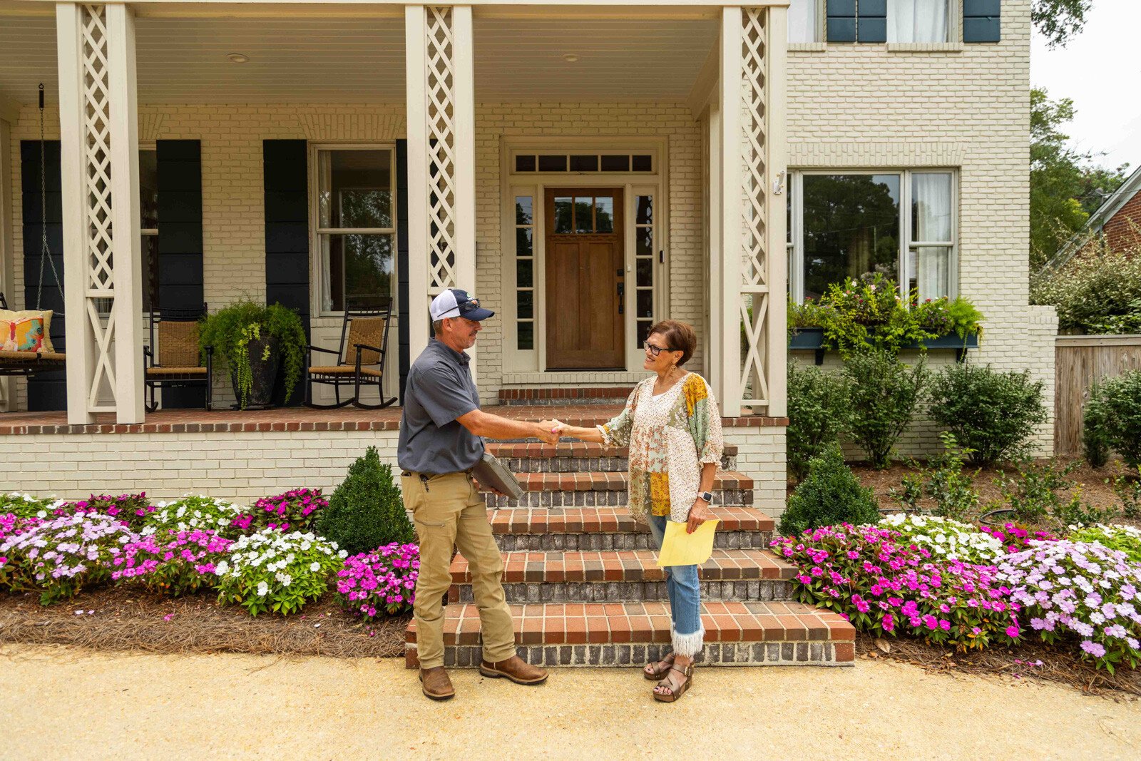 pest control technician client meeting review notes hand shake