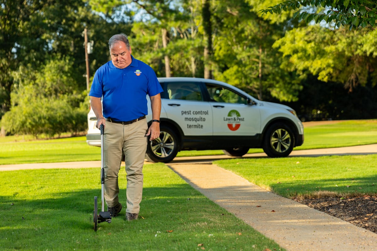 lawn care sales account manager measuring wheel