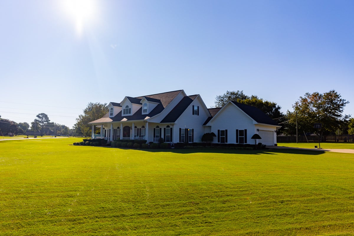 nice house and lawn blue sky