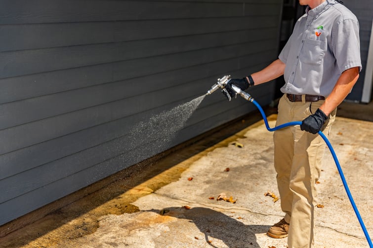 pest control technician outdoor foundation spray 2