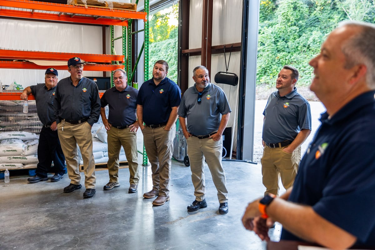 team meeting at shop garage