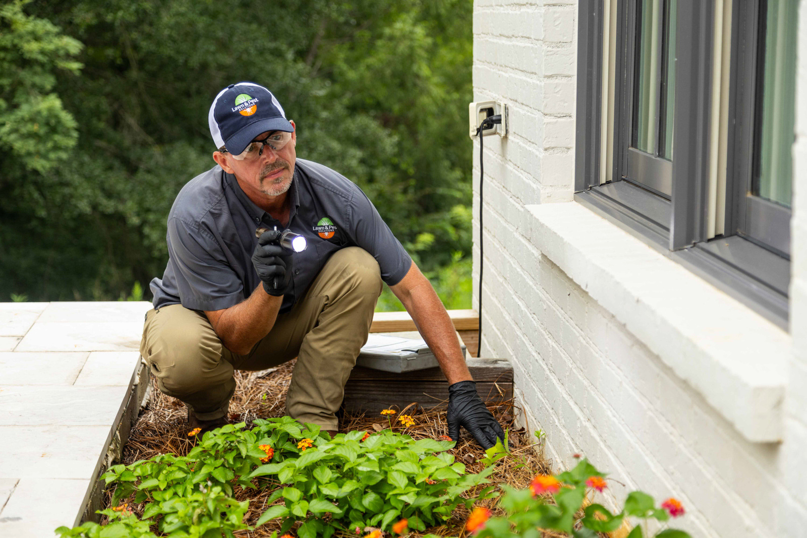 pest control tech crew window flower bed inspection 4