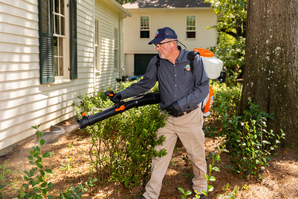 mosquito control pest control technician spraying barrier spray 2